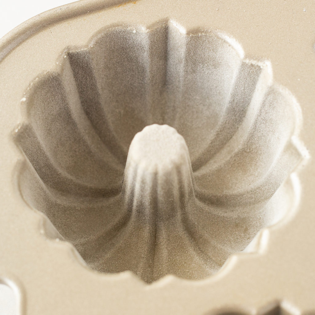 a mini bundt pan with a floured surface