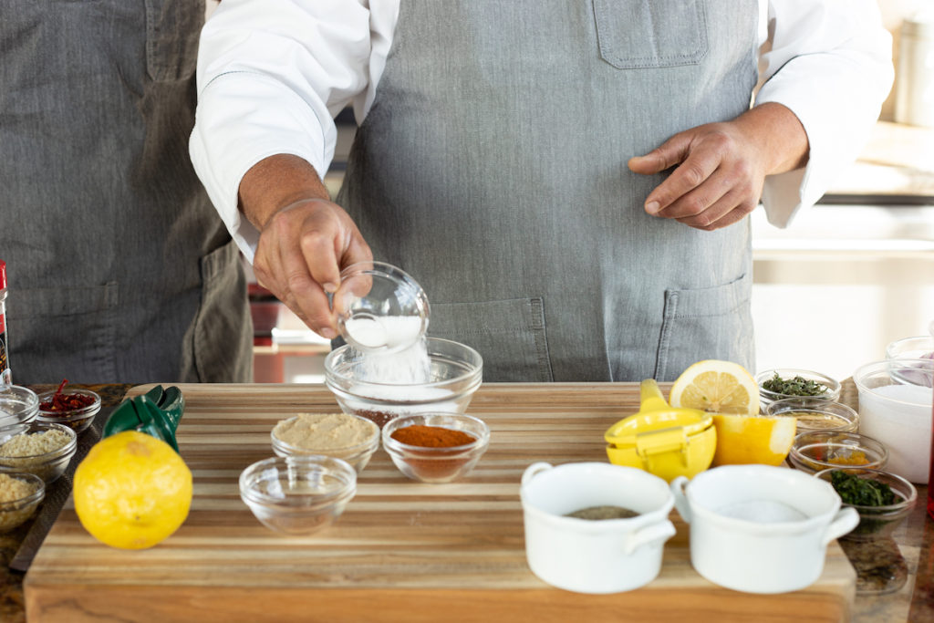 Chef Todd pouring sugar