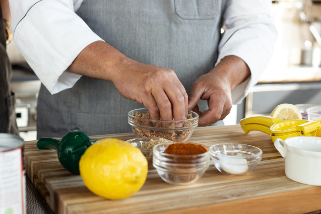 Chef Todd mixing the rub with his fingers