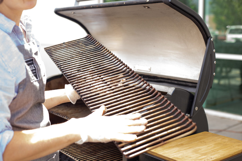 The pellet grill rack being removed. 