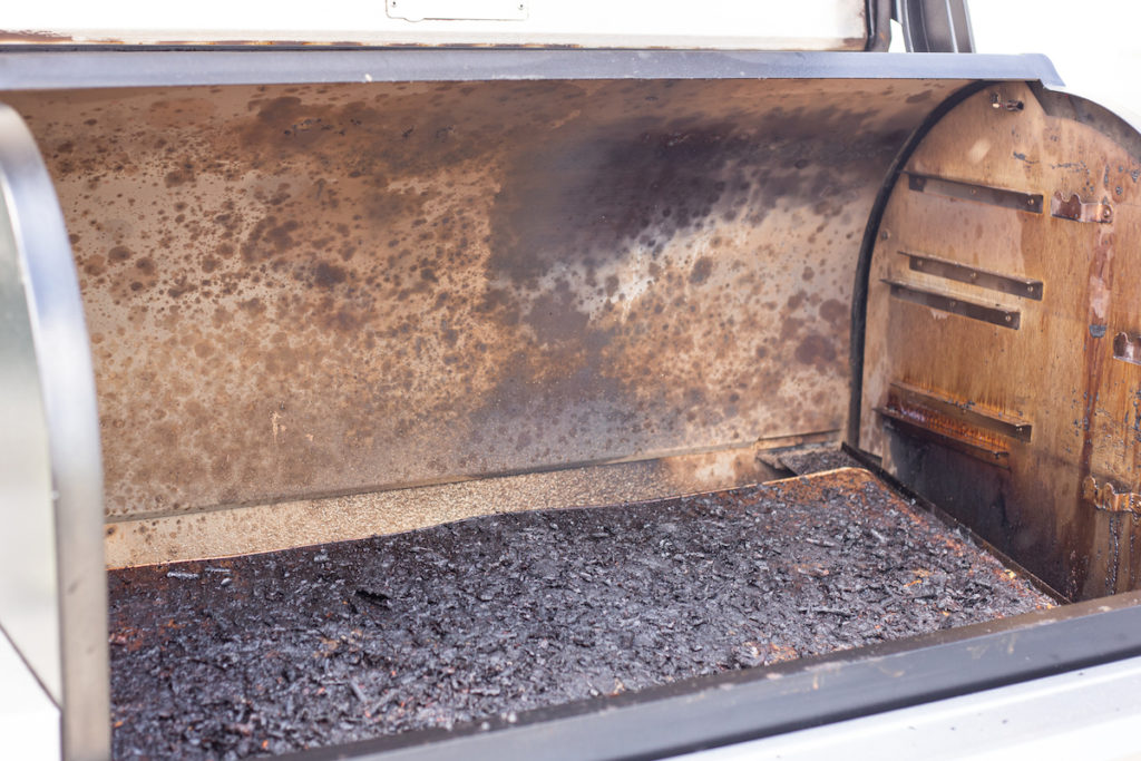 Pictured is a drip tray liner full of  burnt food 