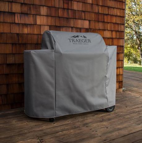 A Traeger smoker with cover. 