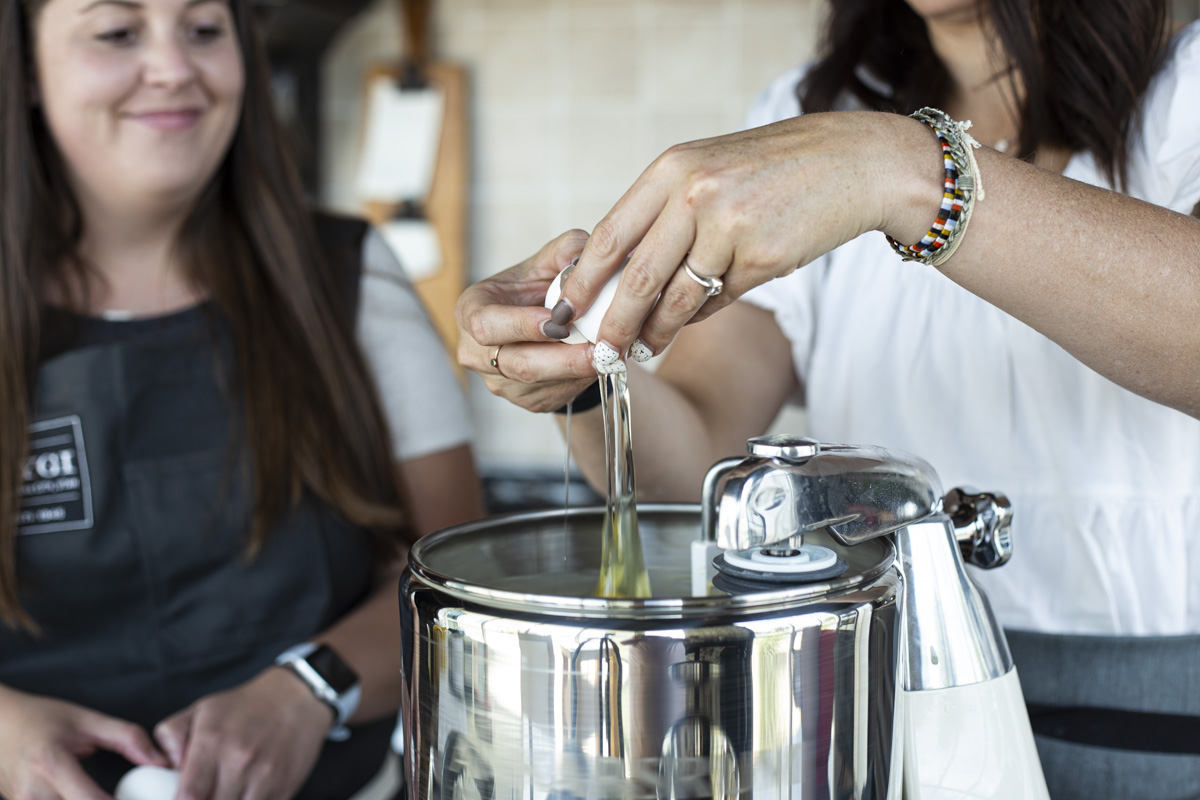 Cracking an egg into the stand mixer bowl