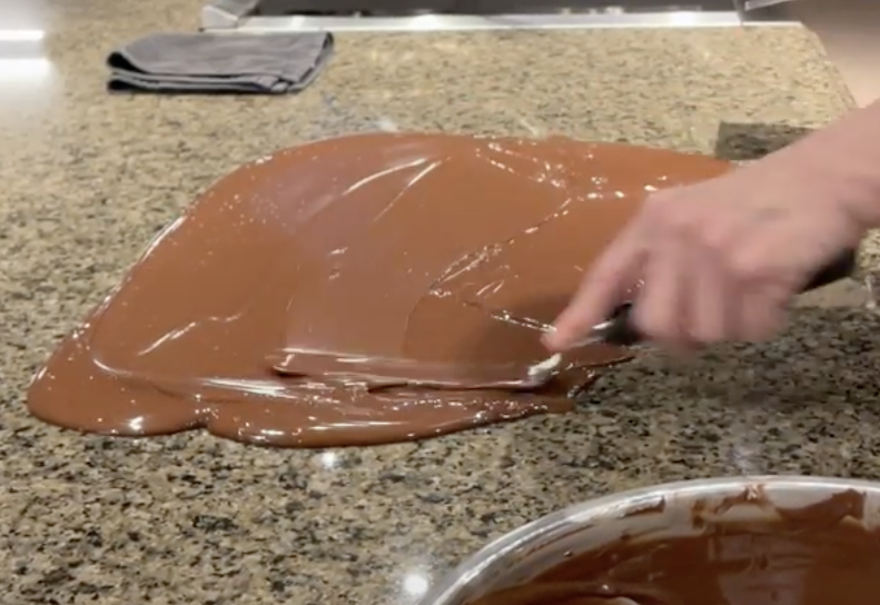 Rebecca tempering chocolate on a slab