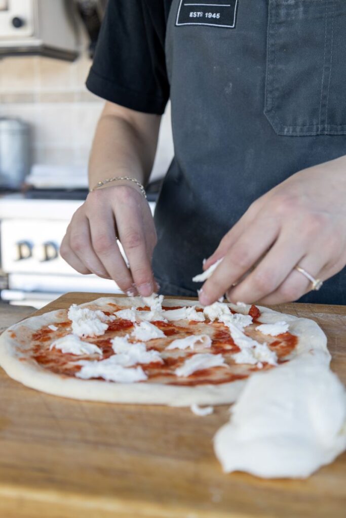 preparing pizza for Gozney