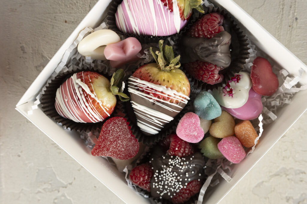 chocolate-covered strawberries packaged in heart box