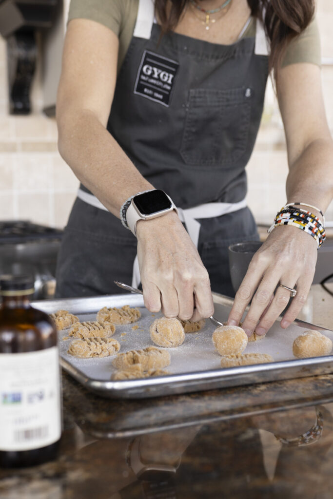 pressing peanut butter cookies