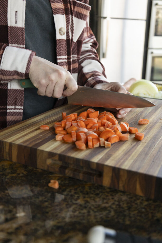 chefs knife cutting carrots